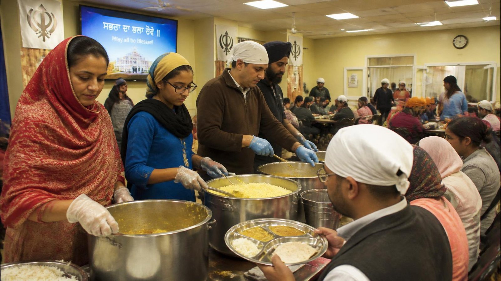 Volunteers serving community langar meal at a gurudwara in Maryland